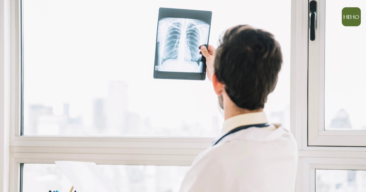 rear-view-male-doctor-examining-chest-x-ray